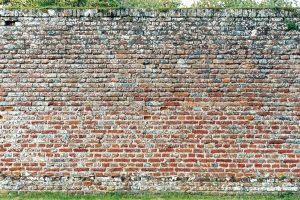 Old brick wall with lime mortar